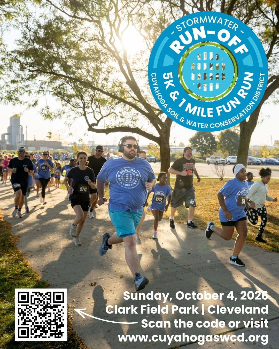 tree lined sidewalk with several joggers of all ages running in the Stormwater run-off.