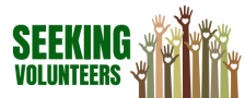 Green letters spelling "Seeking volunteers" and several differend colored raised hands with with hearts on each palm