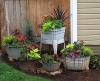 Plants on white stands in pots